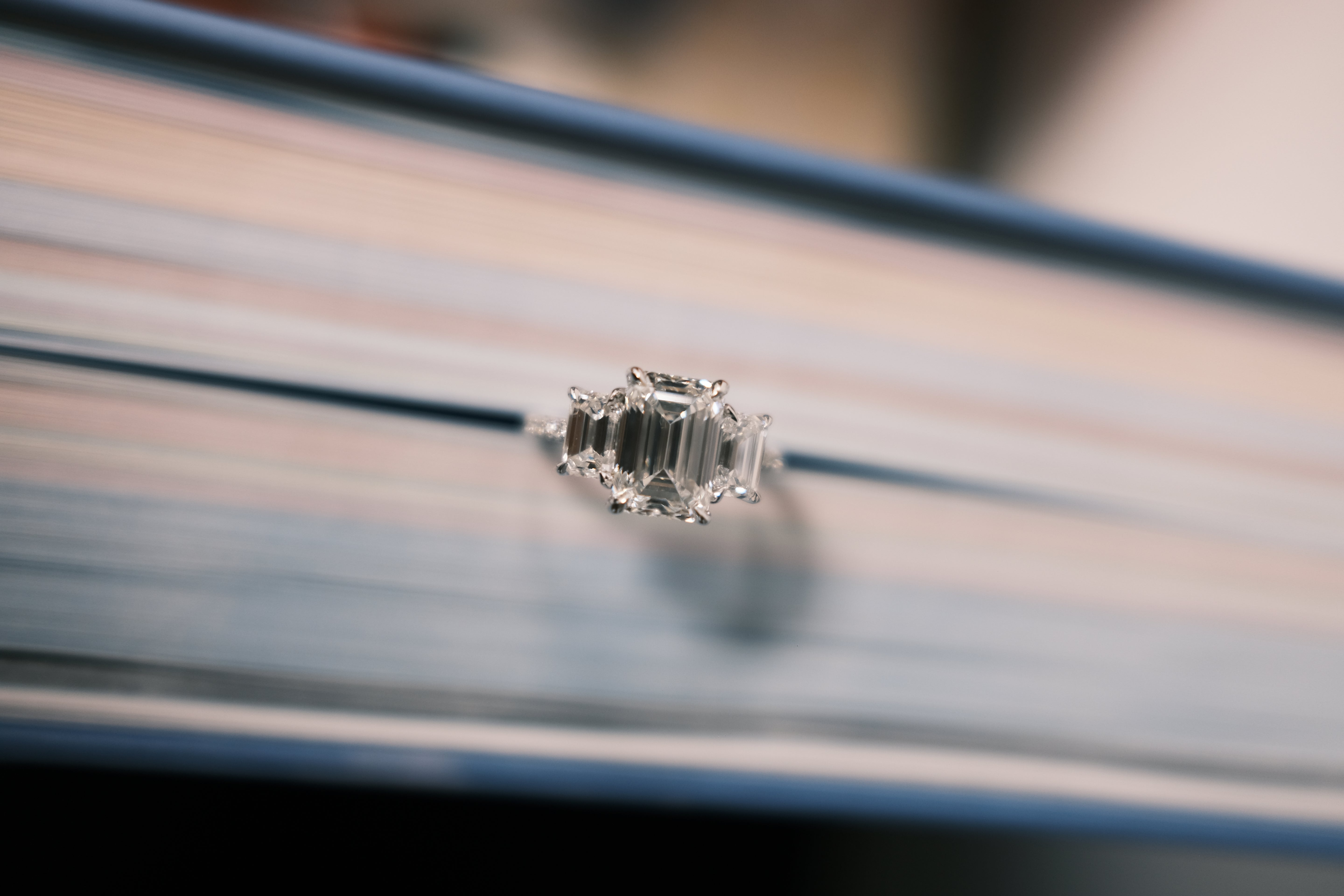 CA 3 stone emerald cut diamond ring top view