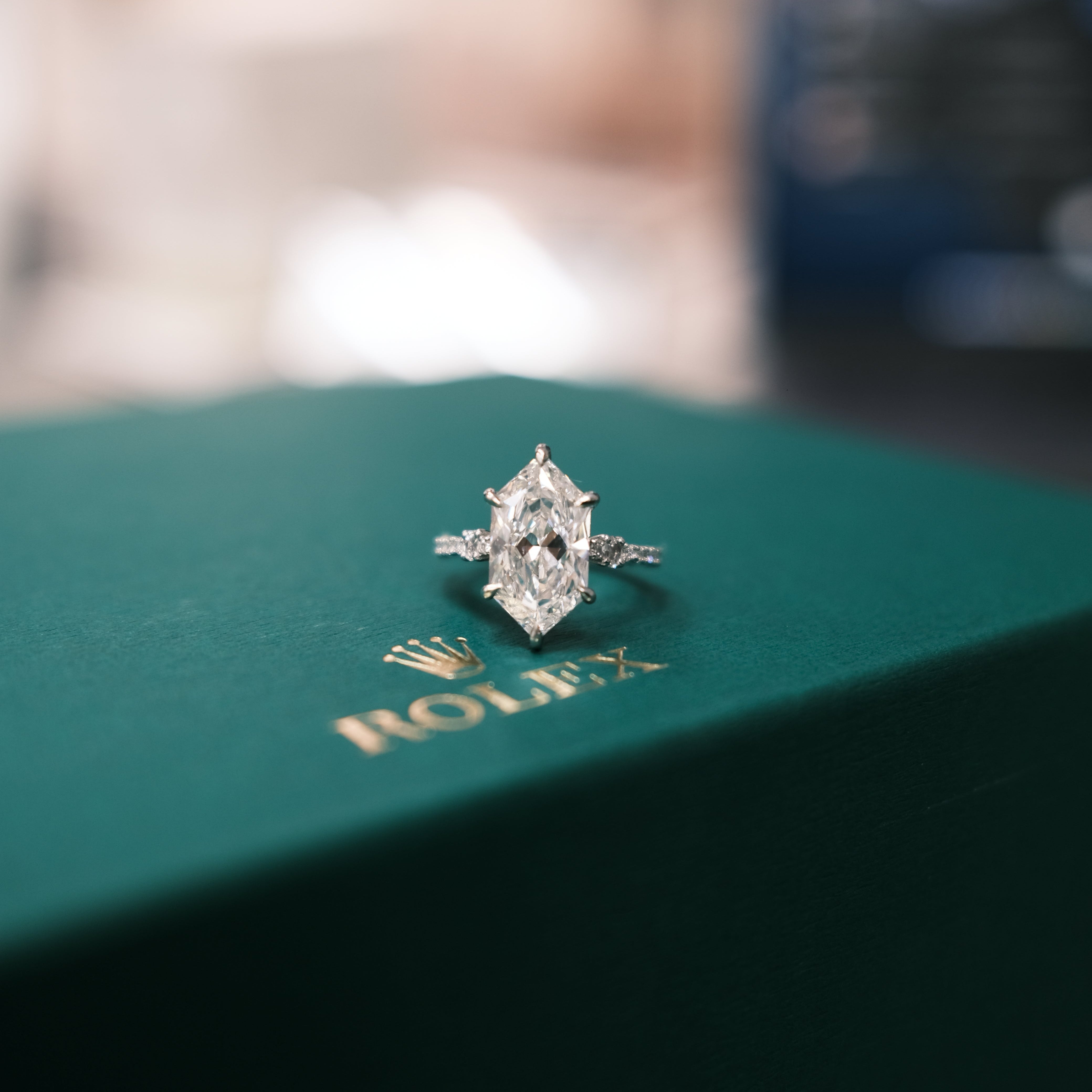 Diamond RING on a green jewelry box with Rolex logo