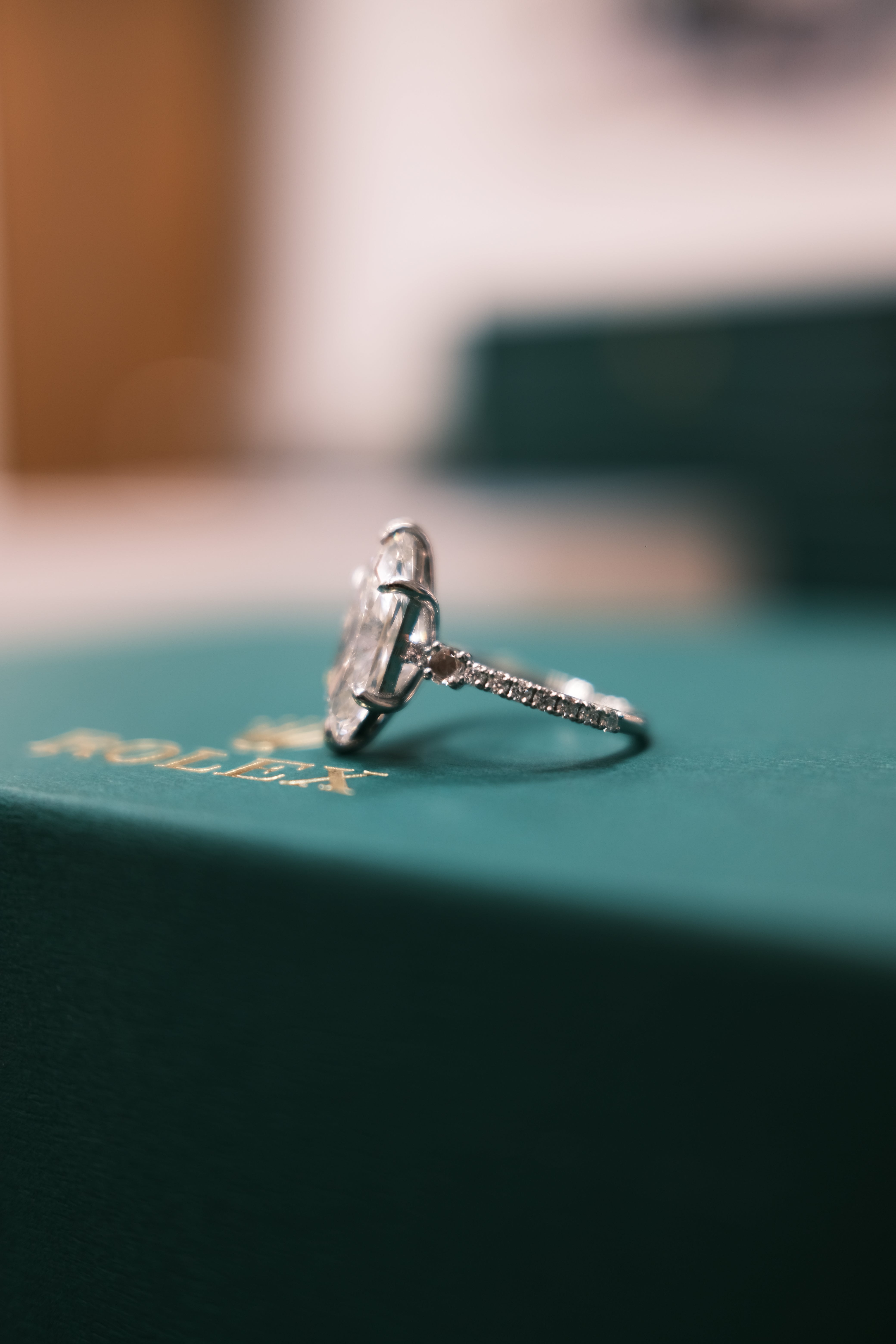 engagement ring on a Rolex box side image