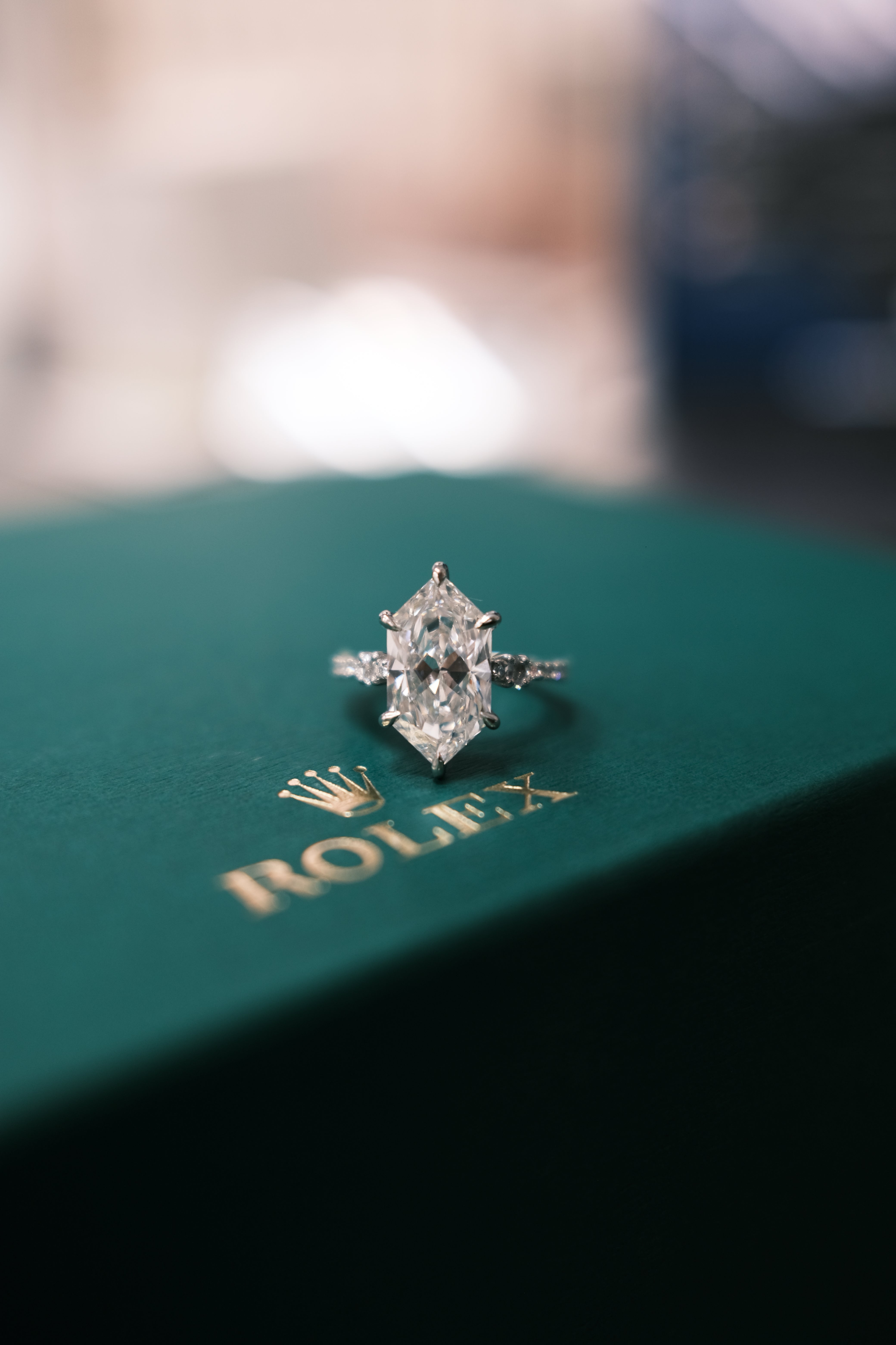 engagement ring on a Rolex box 2