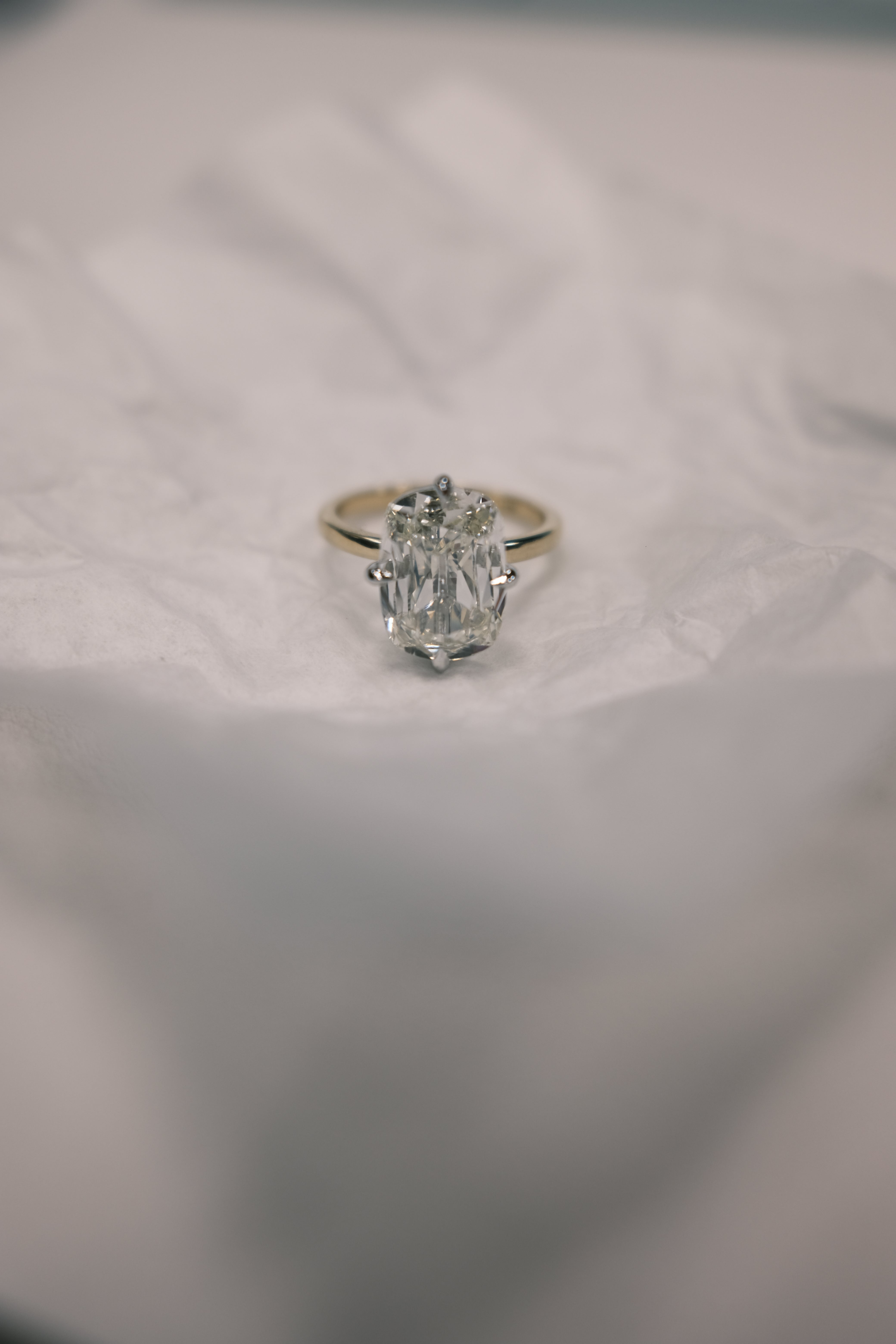 RO Solitaire Engagement Ring on a paper
