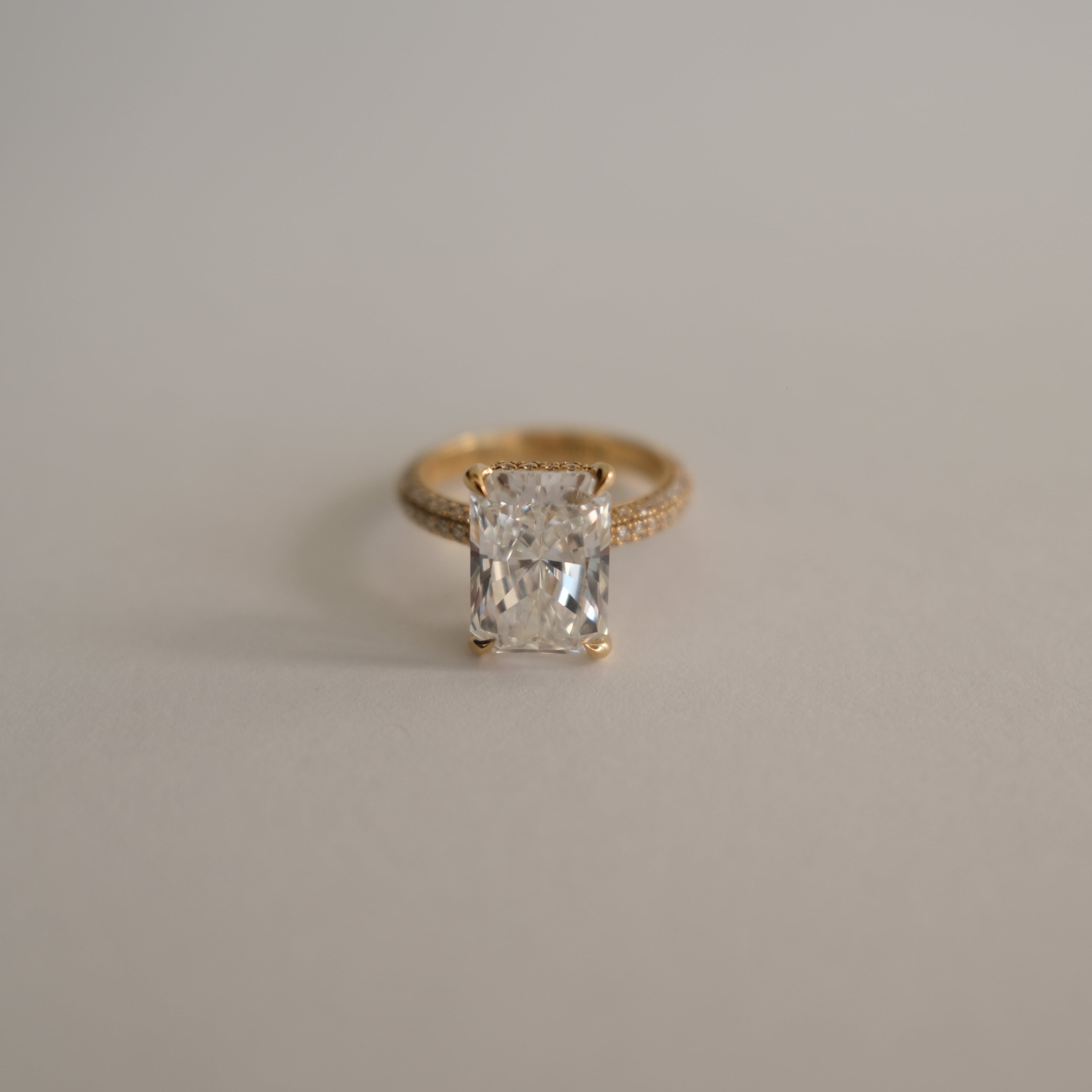 MR RC Solitaire diamond ring with melees on the band top view
