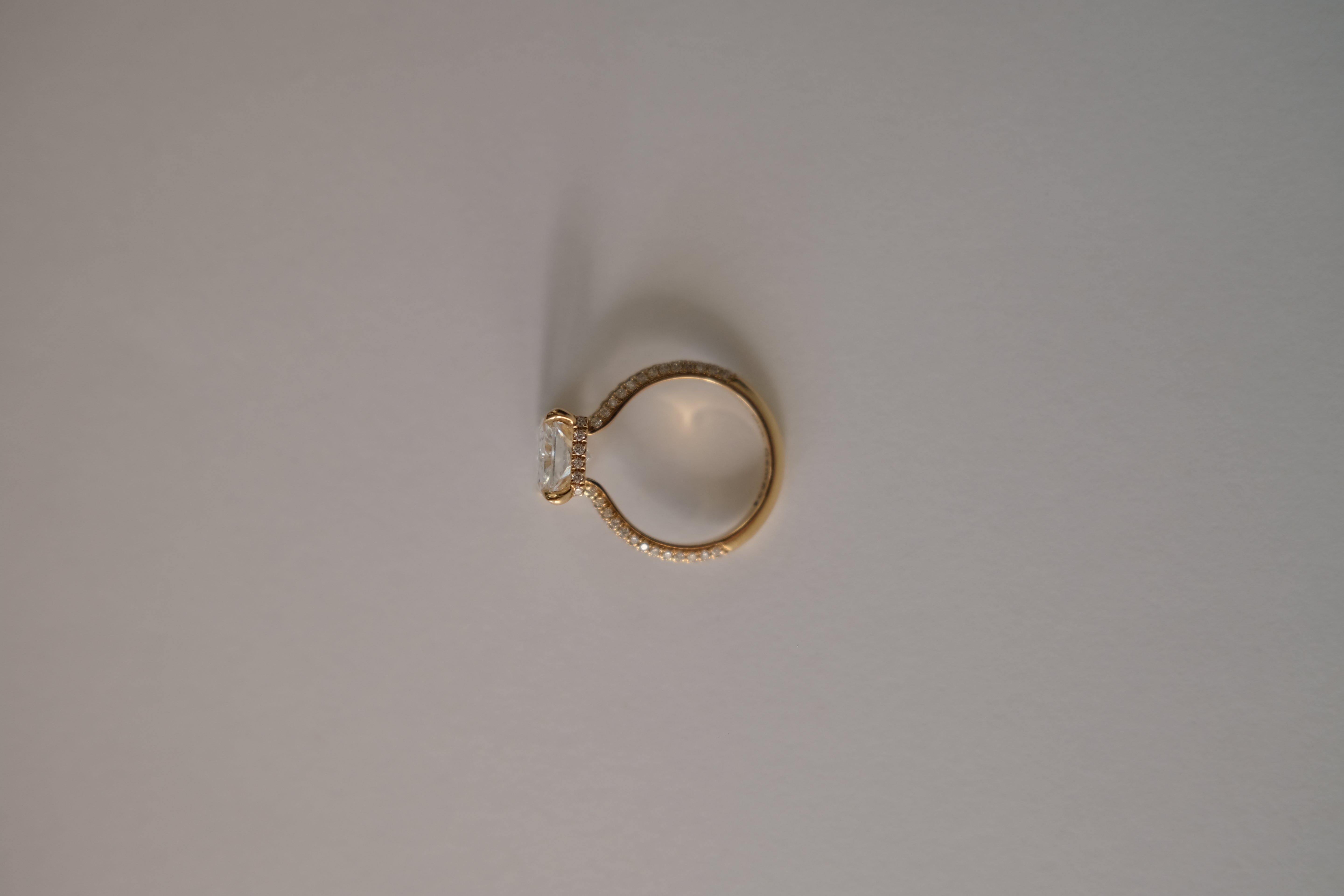 MR RC Solitaire diamond ring with melees on the band side view