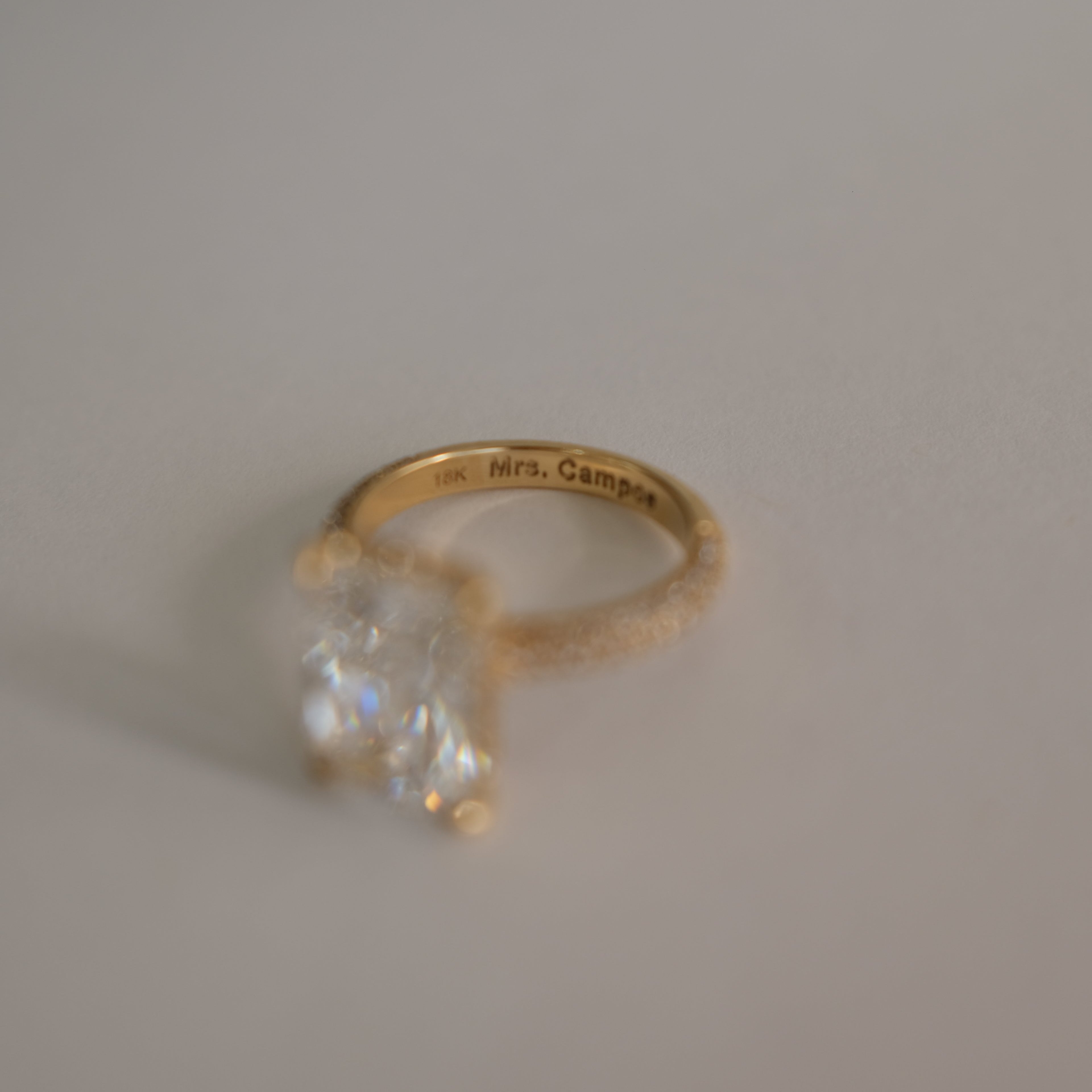 MR RC Solitaire diamond ring with melees on the band showing band engraving