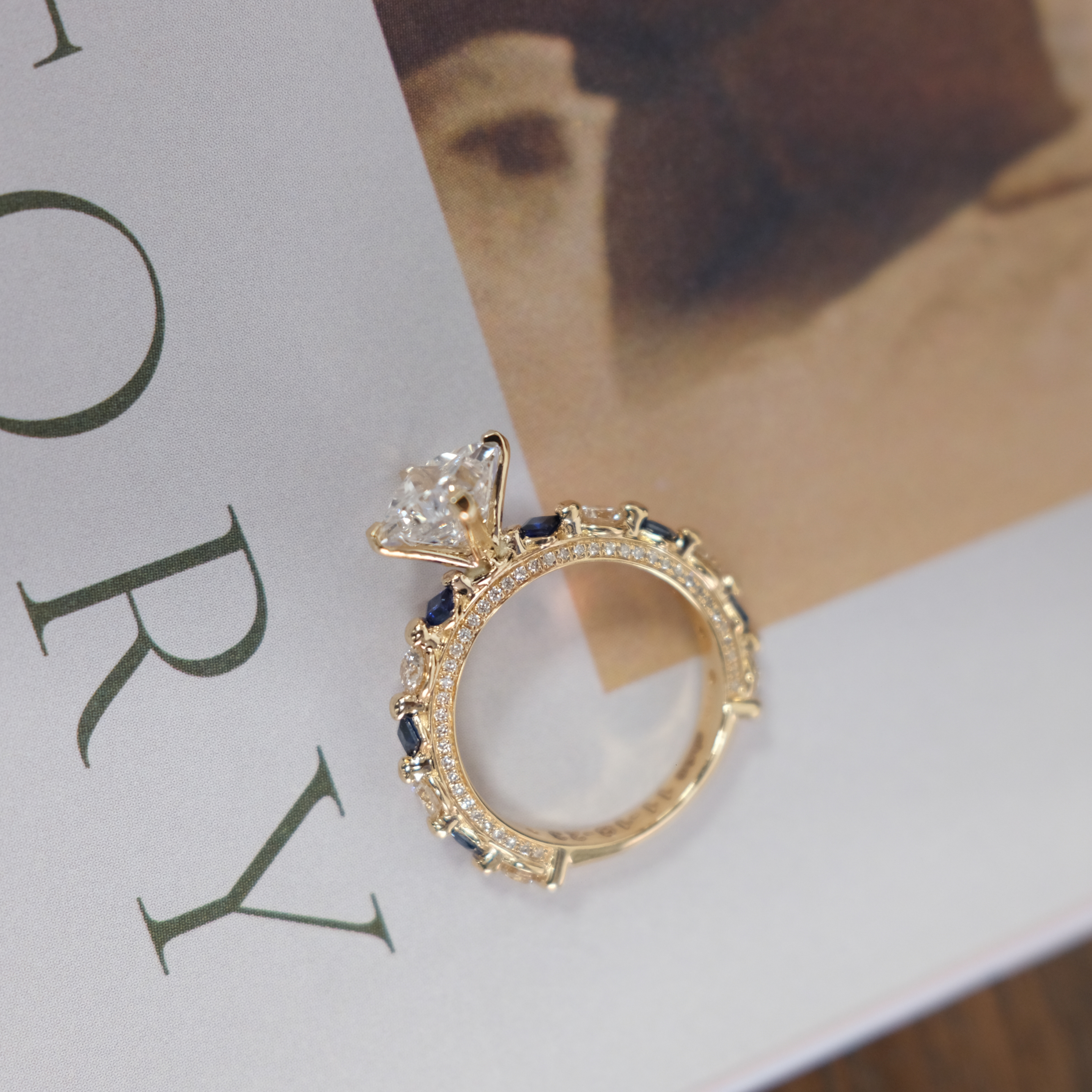 JA Diamond Solitaire ring with sapphire  & Diamond melees side details